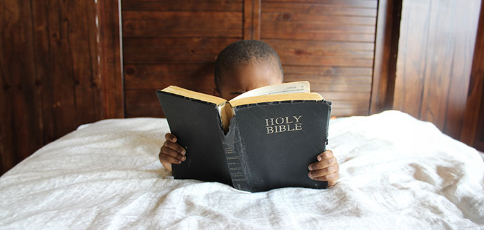 Child Studying Bible
